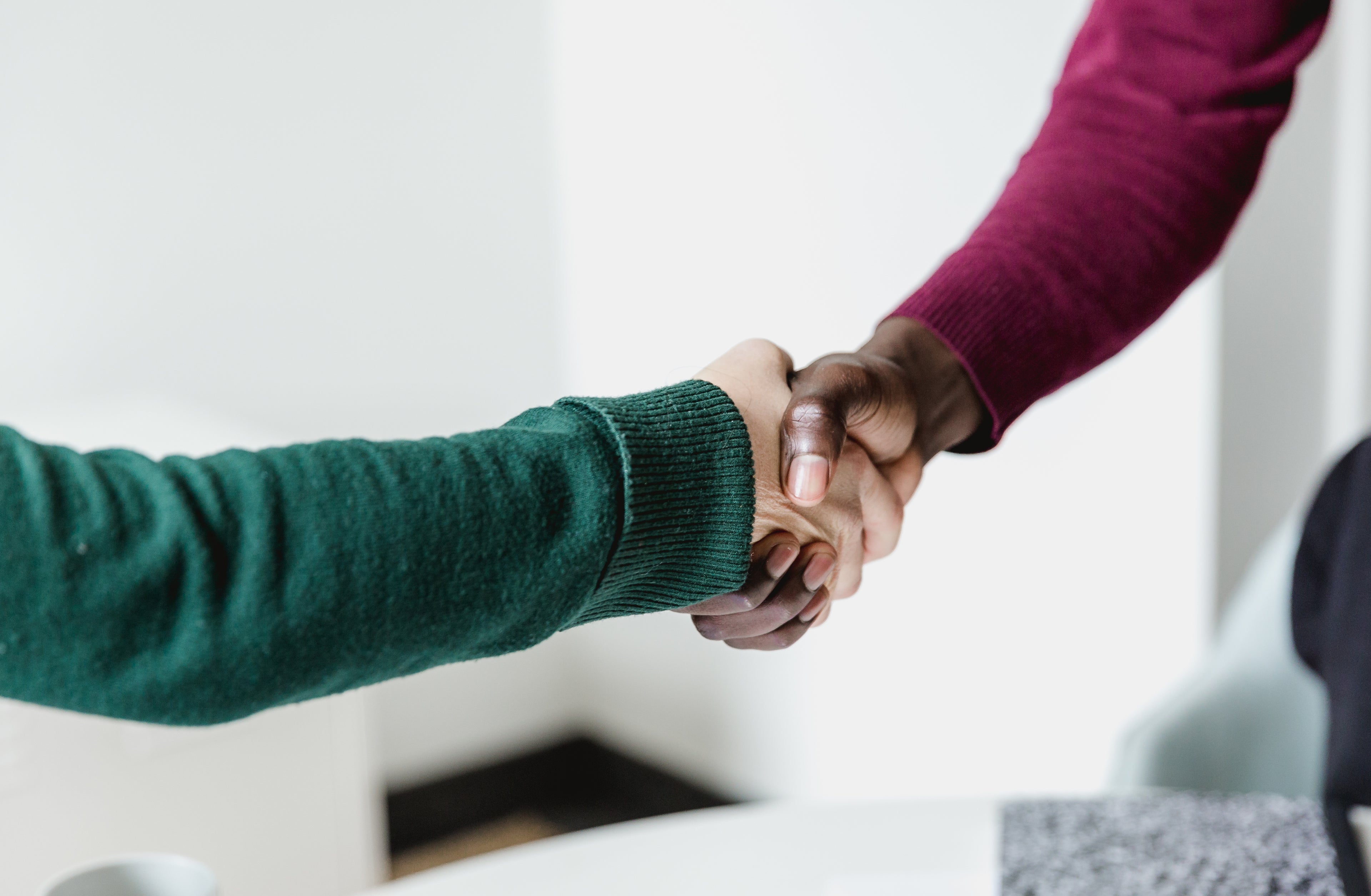 Handshake between two people.